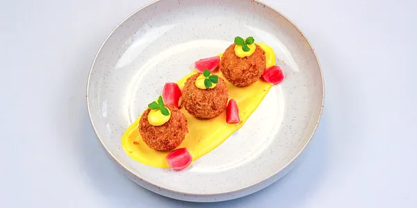 spicy arancini filled with salsiccia,