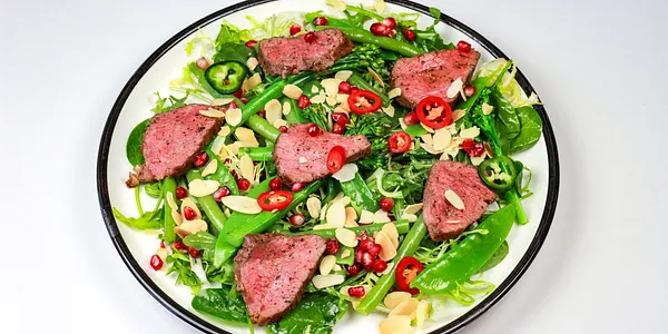 beef rump steak with leaf salad,