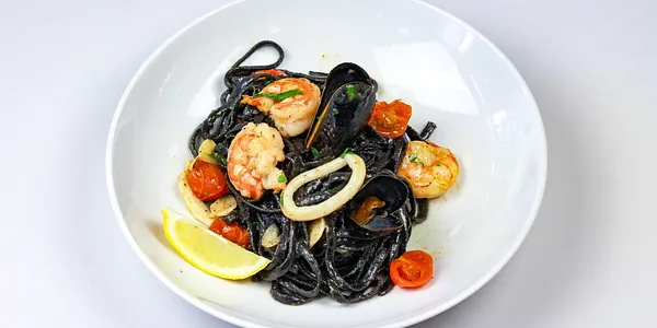 sepia linguine with prawns, calamari and mussels,
