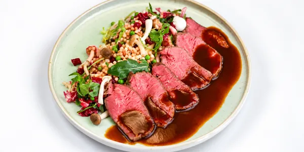 beef rump steak with leaf salad,