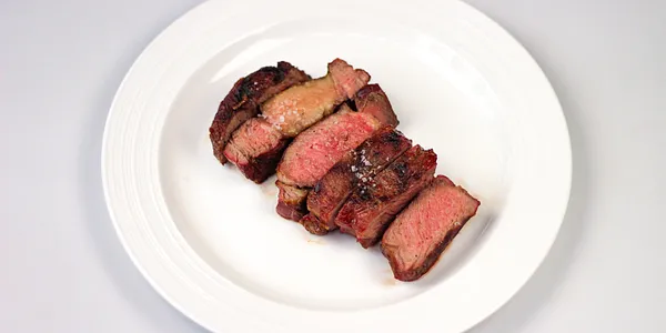 beef rib eye steak grilled over the wood charcoals