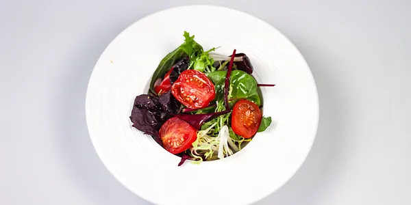 side dish to meat - salad leaves with cherry tomatoes, olive oil 